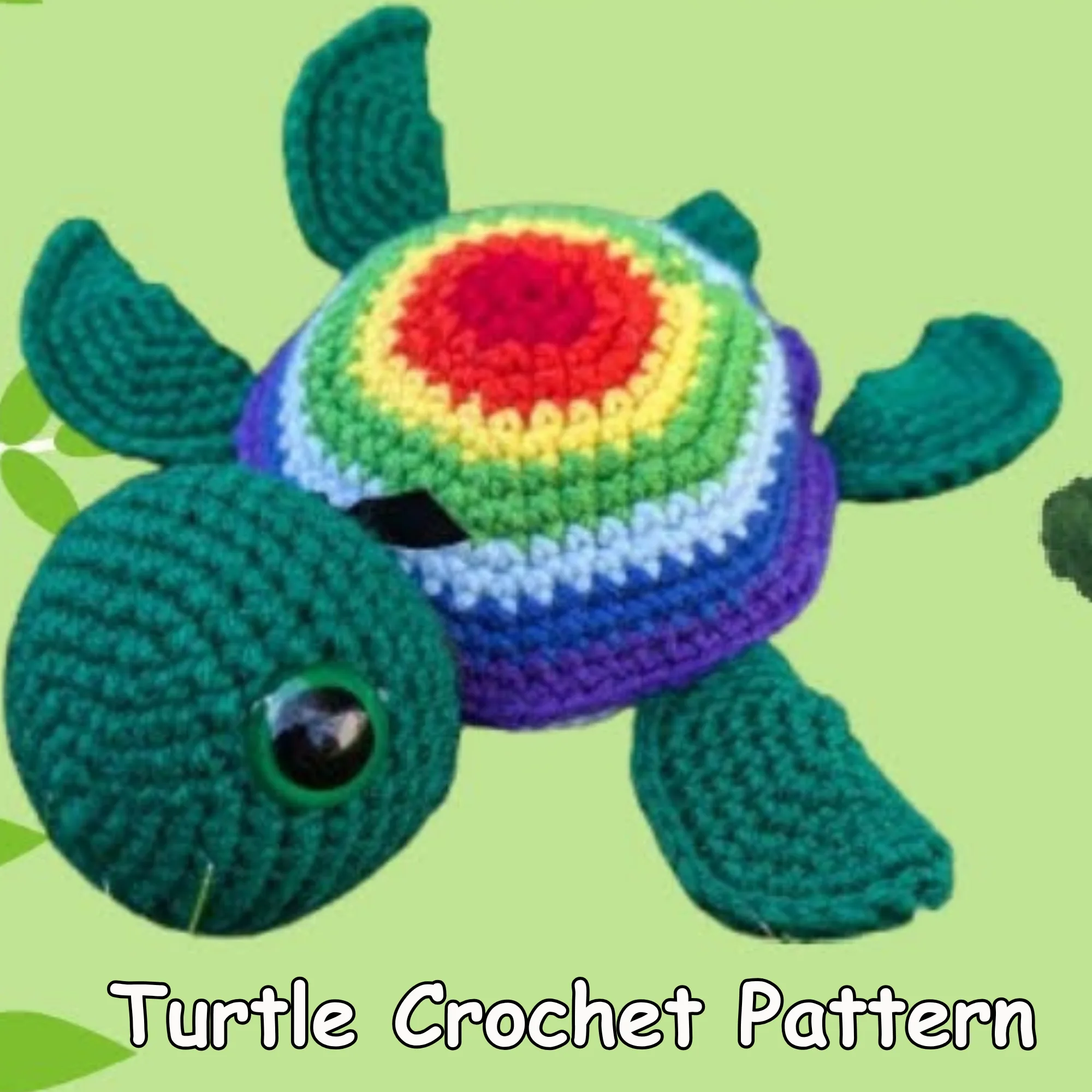 Turtle crochet pattern featuring a colorful rainbow shell, green head, four fins, and safety eyes.