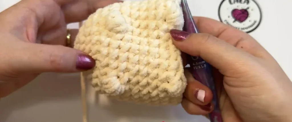Crochet cat body showing the puff stitch legs