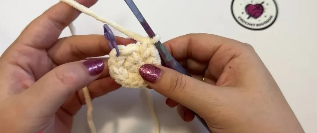 Crochet stitches forming the round cat body