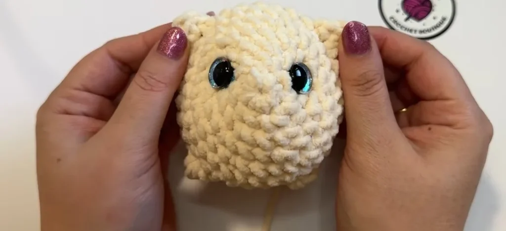 Crochet cat body with two round safety eyes