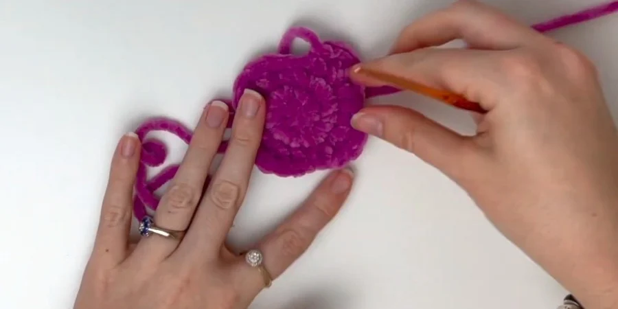 Crocheting a purple heart patch for the strawberry cow plush