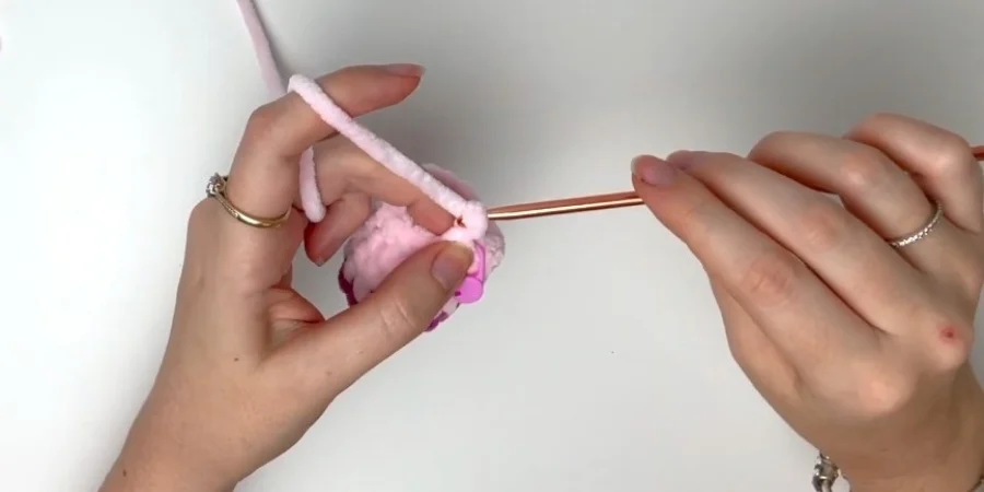 Crocheting a purple and pink leg for the strawberry cow crochet pattern