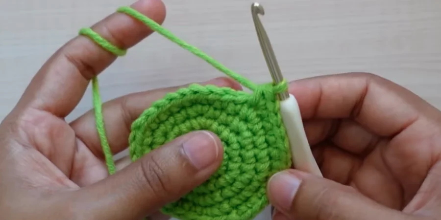 Green crochet sunflower center completed with 36 single crochet stitches