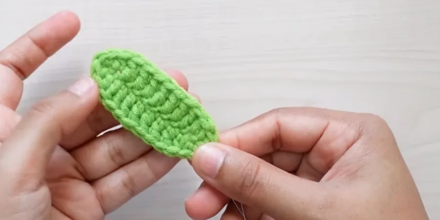 Green crochet sunflower leaf with wire reinforcement inside the leaf