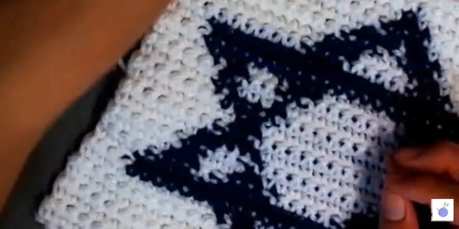 Crochet Star of David Granny Square with the blue motif surrounded by white single crochet rows